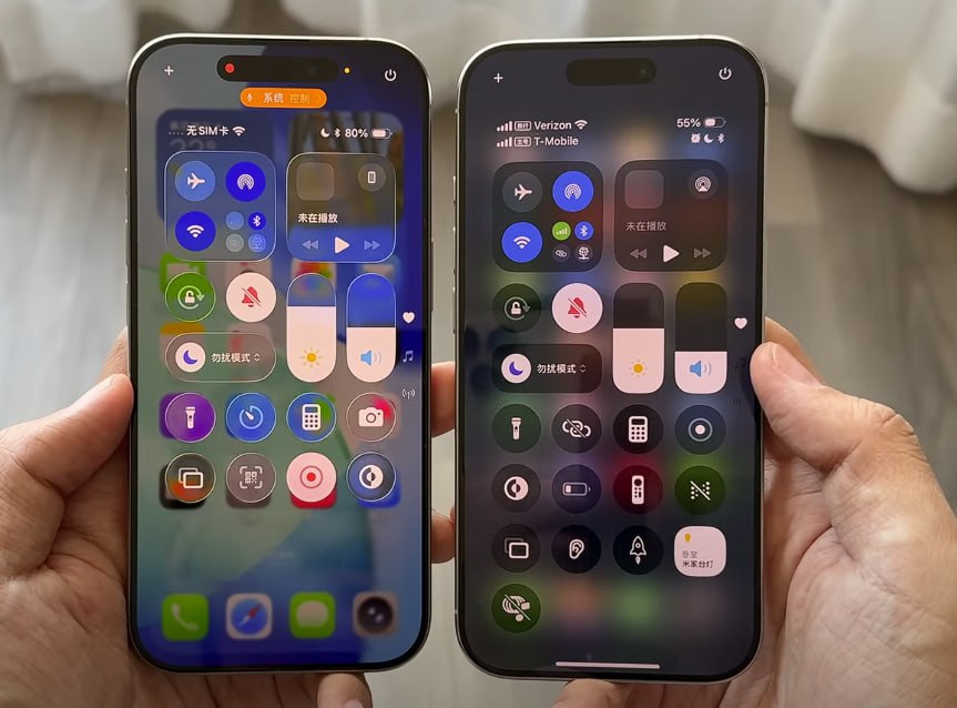 Side-by-side comparison of two iPhones displaying the Control Center interface. The left phone shows a brighter, more colorful interface with rounded buttons and translucent backgrounds, labeled as iOS 26. The right phone shows a darker, more compact design with more subdued tones, representing iOS 18. Both screens display connectivity, brightness, volume, and utility controls, but the iOS 26 layout appears more modern and widget-like.
